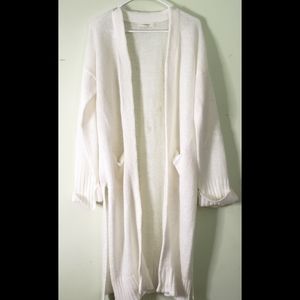 White sweater with light stains on back